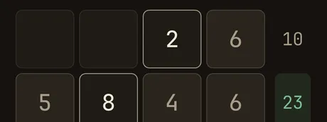 A band of a Crossums grid mid-solve — filled cells and target sums