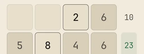 A band of a Crossums grid mid-solve — filled cells and target sums